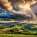 Landscape with rain and dramatic storm clouds over hills - Nuove preoccupanti previsioni meteo per il Nord Italia