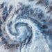 A snapshot of a snowcovered wilderness taken from a satellites viewpoint with a mesmerizing vortex at its center that seems to be spinning the entire storm into place - Meteo, attenzione: la neve potrebbe sorprendere queste città centrali