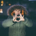 Boy showing love heart with hands outdoors with christmas lights - Previsioni meteo dicembre, Immacolata sotto zero: neve per Natale