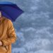 Digital composite of Man with blue umbrella in blue snow forest - Meteo: Immacolata, avremo pioggia, sole o neve?