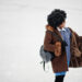 Curly hair african american woman wear on sheepskin coat and glo - Meteo, fermento nella stratosfera: l’inverno è a un bivio