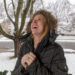 A Young Caucasian Woman Excitedly Waits And Prays For Good News - Il brutto tempo tornerà presto, confermato il crollo meteorologico