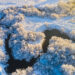 Winter landscape on a frosty day with frost on trees and a river - Meteo: freddo e neve al Nord, forte Libeccio al Centro-Sud