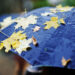 yellow autumn leaves on a black umbrella - Meteo: una depressione artica colpisce l’Italia