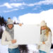 smiling couple in winter clothes with blank board - Caldo per tutto l’anno: l’incubo meteorologico del futuro