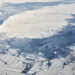 Aerial view over clouds top to snow covered rivers, fields and roads, winter fresh frosty air - Quante previsioni meteo tra sciabolate gelide, Burian e nevicate paralizzanti!