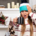 Beautiful young woman posing with cup of tea near the fireplace - Meteo, Immacolata: arrivo dell’irruzione artica e ciclone successivo