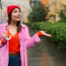 ?harming young woman using transparent umbrella at the street in rainy day - Meteo impazzito: dopo la bufera, l’incredibile colpo di scena