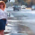 Portrait of red-haired happy woman in the rain - Sorpresa meteo inaspettata: neve sulla Pianura Padana